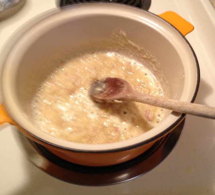 Making the cream sauce by starting with a flour and butter roux