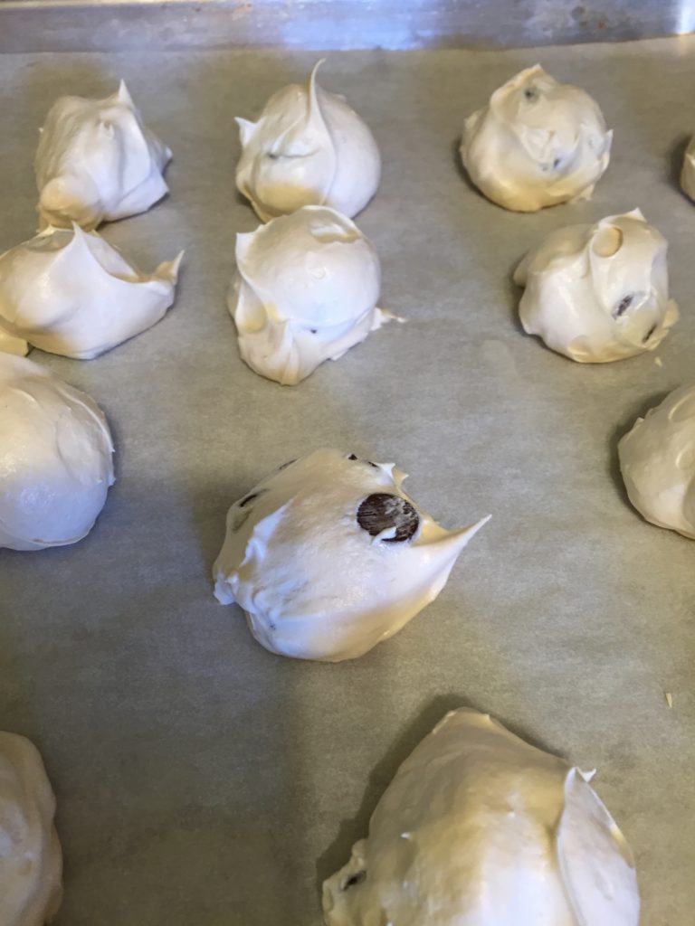 Use a small scoop to drop cookies onto parchment paper