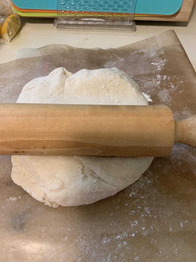 rolling out biscuit dough